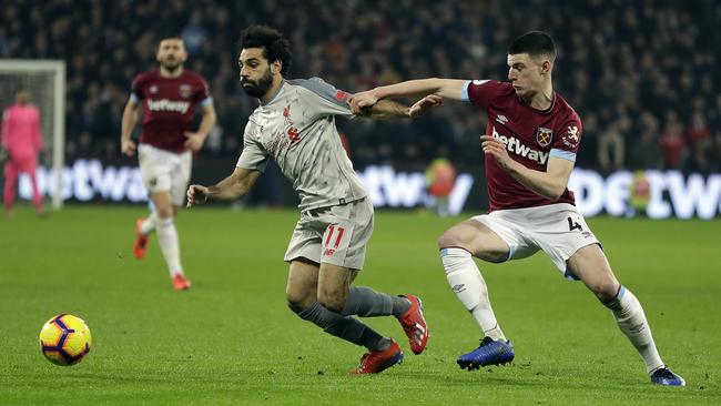 Liverpool's Mohamed Salah, left, and West Ham's Fabian Balbuena challenge for the ball. Picture: AP