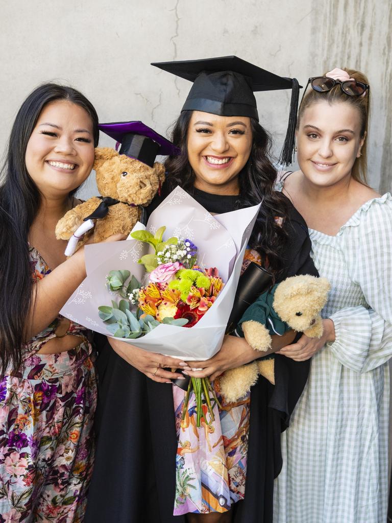 Bachelor of Paramedicine graduate Katherine Rivera with friends Cathy Nguyen (left) and Laura Sharp at the UniSQ graduation ceremony at Empire Theatres, Wednesday, December 14, 2022.