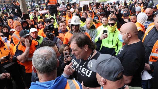 Construction workers are seen confronting CFMEU boss John Setka outside the union’s headquarters. Picture: David Crosling