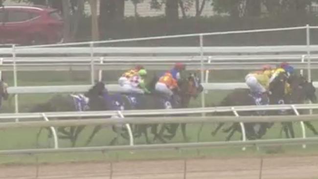 Jockey Rachel Shred hits the Cluden Park surface after taking fall in race.