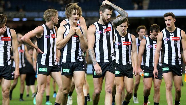 Collingwood players leave the field after Sunday’s loss. Picture: AAP Images