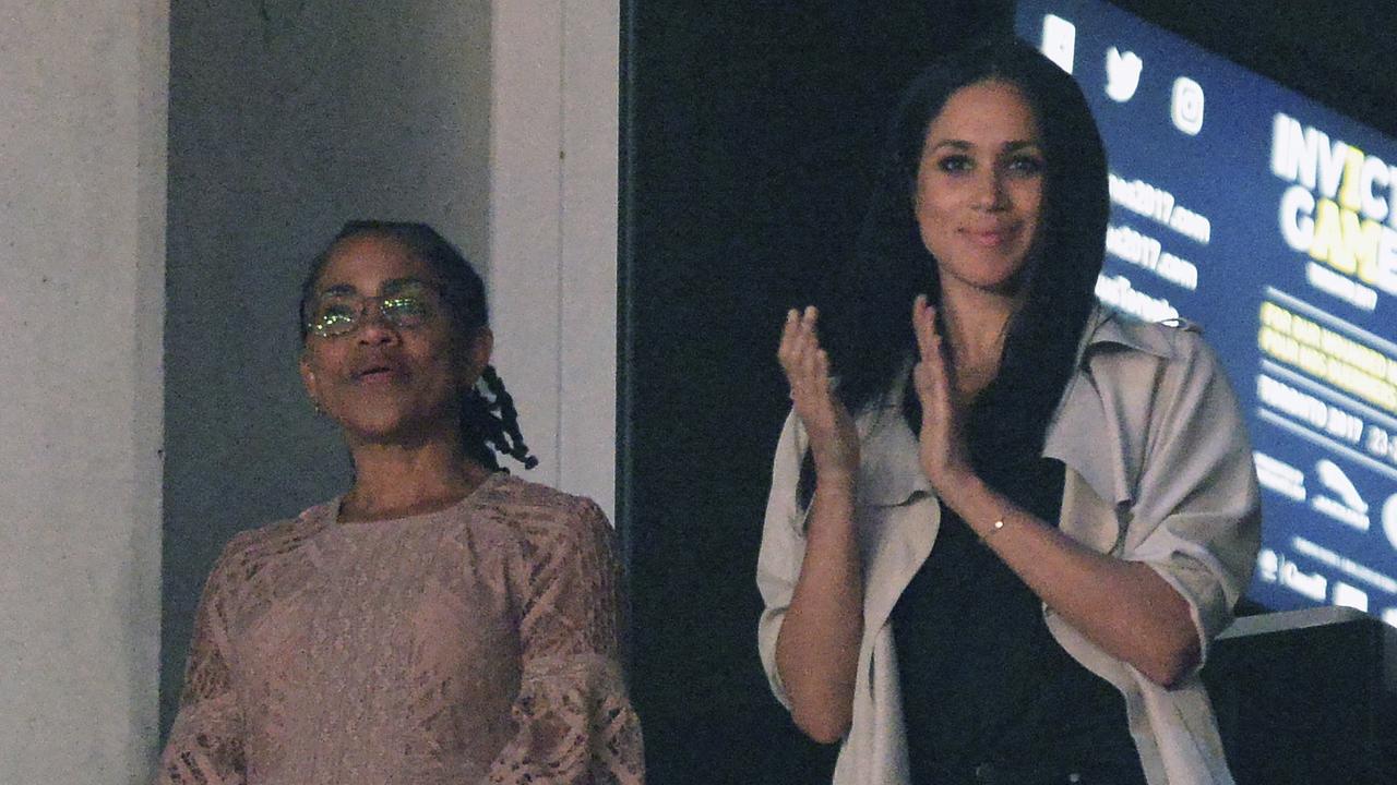 Meghan Markle, right, watches the closing ceremonies of the Invictus Games with her mother Doria Ragland in Toronto last year. Picture: Nathan Denette/The Canadian Press via AP