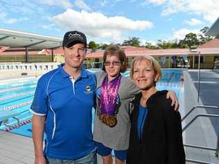 SUCCESS: Sarah Wallace, 16, is a passionate swimmer with a disability, with dreams of representing Australia in the Paralympics. Sarah pictured with her coach Aaron Belshan and mum Leonie. Picture: Patrick Woods
