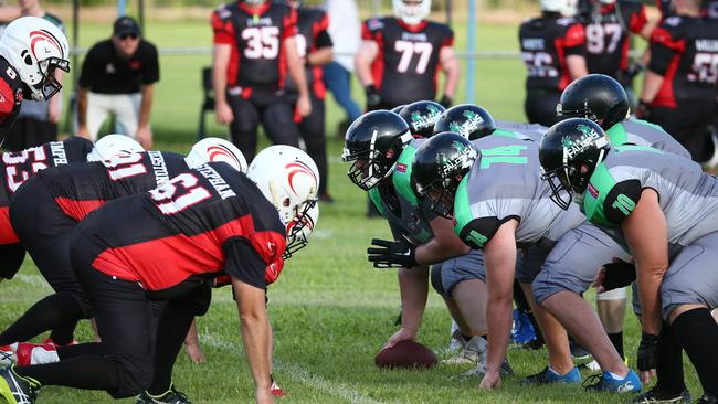 The Falcons line up for a play in the NQ Gridiron series match between the Cairns Falcons and the Townsville Cyclones, held at Vico Oval, Mooroobool. PICTURE: BRENDAN RADKE