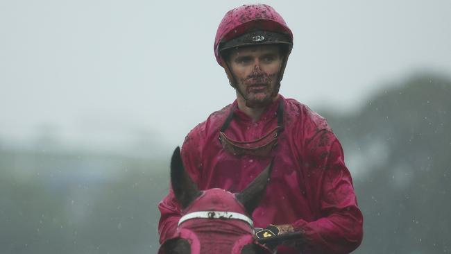 A mud splattered Sam Clipperton returns after guiding Cigar Flick to victory at Rosehill. Picture: Getty Images