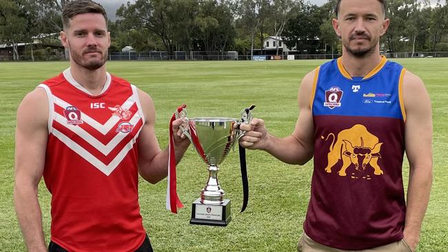 Yeppoon vice-captain Leigh Cossens (left) and Glenmore co-captain/coach Tim Higgins with the prized premiership trophy, which will be presented to the grand final winner on Saturday.