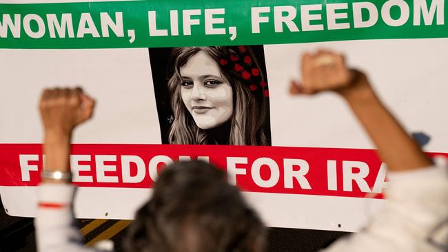 Demonstrators chant slogans while marching during the "March of Solidarity for Iran" in Washington, DC, on October 15.