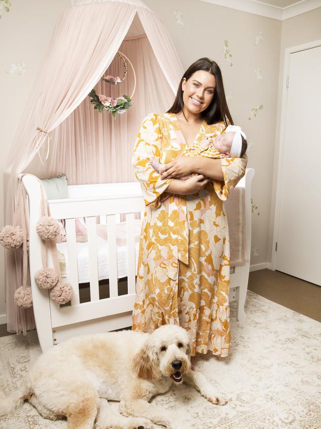 Courtney Thorpe, with her daughter Kennedy and pup Bailey, said there is too much pressure on new mums to drop their “baby weight". Photo: Nigel Hallett.