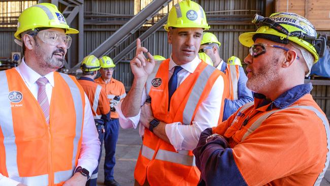 Premier Peter Malinauskas and Federal Minister Ed Husic (left) talk to steelworker Matt Rogers at the Whyalla steel plant on April 4. Picture: GFG ALLIANCE/Brenton Edwards