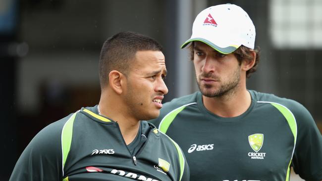 Australia batsmen Usman Khawaja (L) and Joe Burns (R).