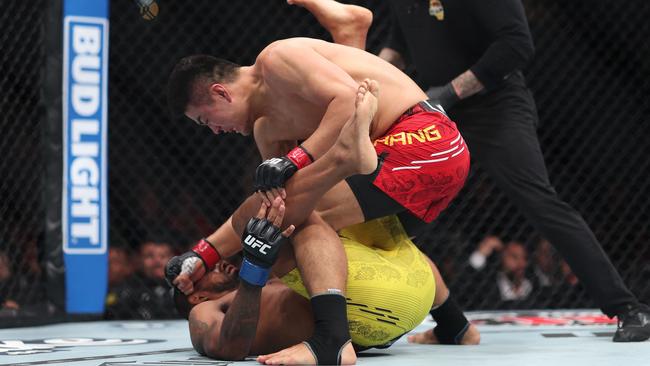 Zhang Mingyang of China punches Brendson Ribeiro in their light heavyweight fight during UFC 298. Photo: Sean M. Haffey/Getty Images/AFP.