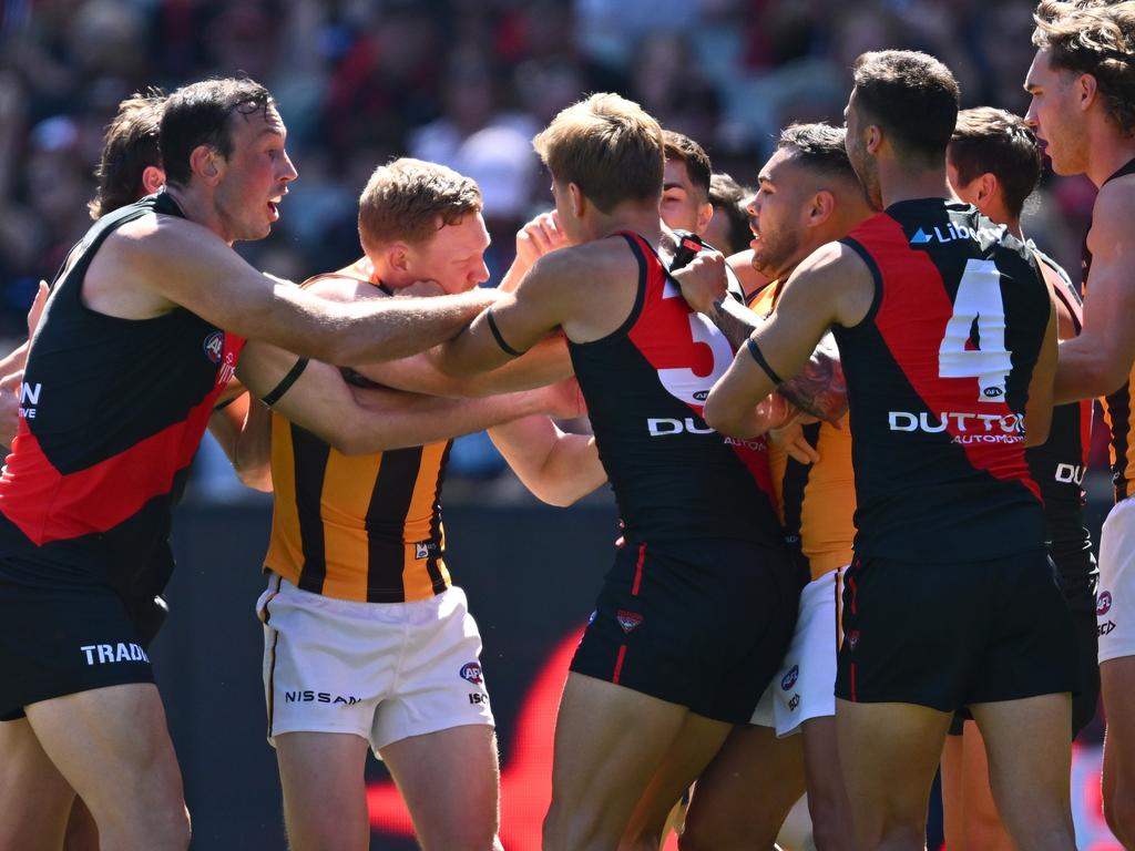 Bombers players remonstrate with James Sicily. Picture: Quinn Rooney/Getty Images