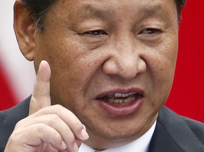 Chinese President Xi Jinping gestures during a joint new conference with President Barack Obama, Friday, Sept. 25, 2015, in the Rose Garden of the White House in Washington. (AP Photo/Evan Vucci)