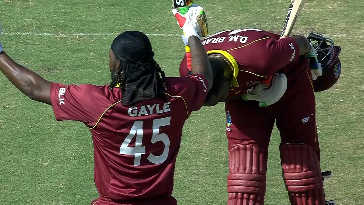 Chris Gayle celebrates his century in the fourth ODI against England.