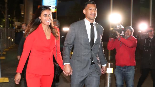 A beaming Maria and Israel Folau leave the Federal Circuit Court in Melbourne on Monday. Picture: AAP/David Crosling