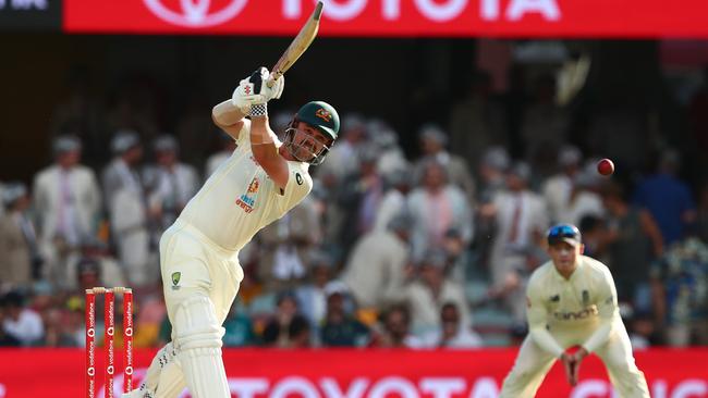 Travis Head hits during his century at the Gabba yesterday. Picture: Getty Images.