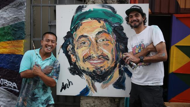 Portrait of a man ... Anh Does Brazil host Anh Do with Brazilian street artist Kobra. Pic: Supplied.