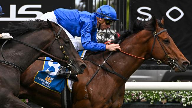 MELBOURNE, AUSTRALIA - SEPTEMBER 10: Blake Shinn riding Spacewalk winning Race 1, the Winning Edge Poseidon Stakes, but loses race on protest to Craig Newitt riding Buenos Noches (L) during Melbourne Racing at Flemington Racecourse on September 10, 2022 in Melbourne, Australia. (Photo by Vince Caligiuri/Getty Images)