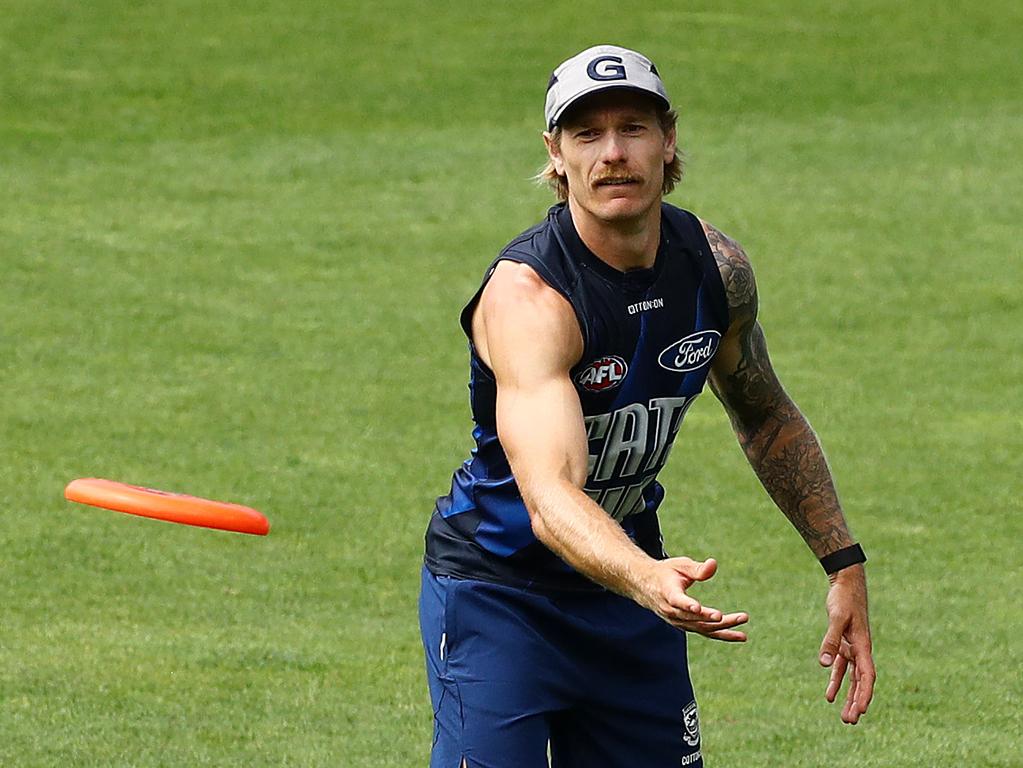 Tom Stewart throws a frisbee during Geelong’s light session. Picture: Alison Wynd