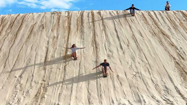 Sandboarding fun at Anna Bay. Picture: Contributed