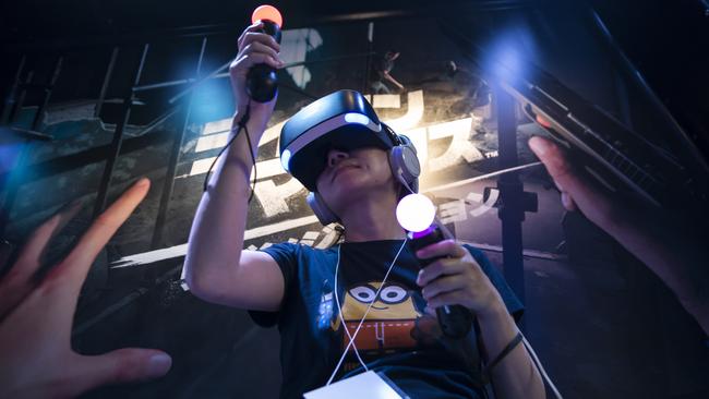 A gamer wears a PlayStation VR headset. Picture: Getty Images