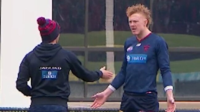 Melbourne midfielder Clayton Oliver in a heated discussion with a Dees trainer mid-season.