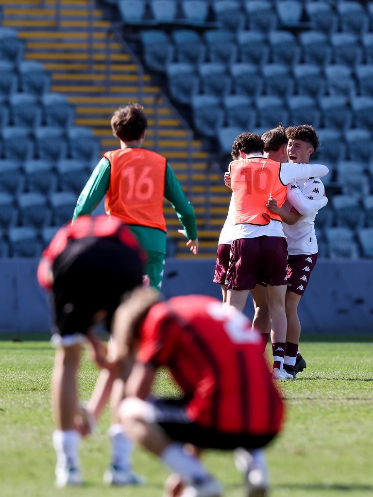 Queensland U16 White players celebrate their National Youth Championships semi-final win. Picture: Damian Briggs/Football Australia)