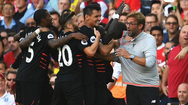 Liverpool players celebrate wildly.
