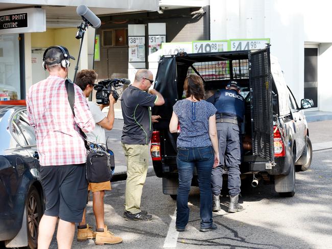 Police arrest a man outside The Cav hotel under the eyes of a camera crew from the TV show <i>Territory Cops</i>. Picture: Patrina Malone