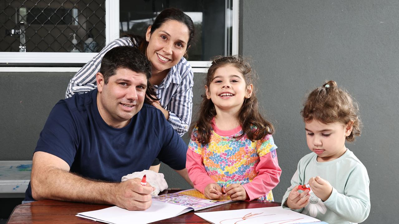 Tegan Catalano, is pushing for better pediatric cardiac care in Far North Queensland, with only one pediatric cardiologist based in Cairns. Violet Catalano, 4, pictured with her father Adam Catalano, and sister Marli Catalano, 2 at their Malanda home. Picture: Brendan Radke