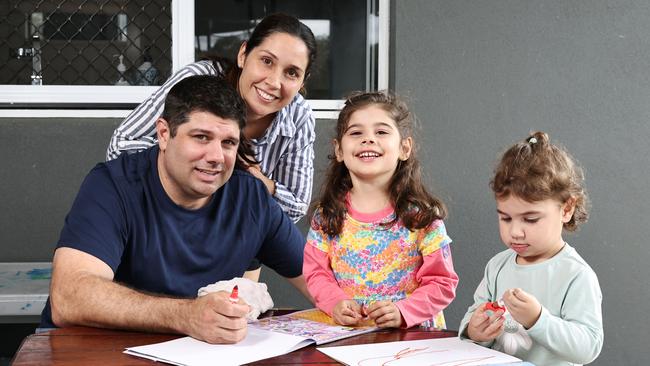 Tegan Catalano, is pushing for better pediatric cardiac care in Far North Queensland, with only one pediatric cardiologist based in Cairns. Violet Catalano, 4, pictured with her father Adam Catalano, and sister Marli Catalano, 2 at their Malanda home. Picture: Brendan Radke