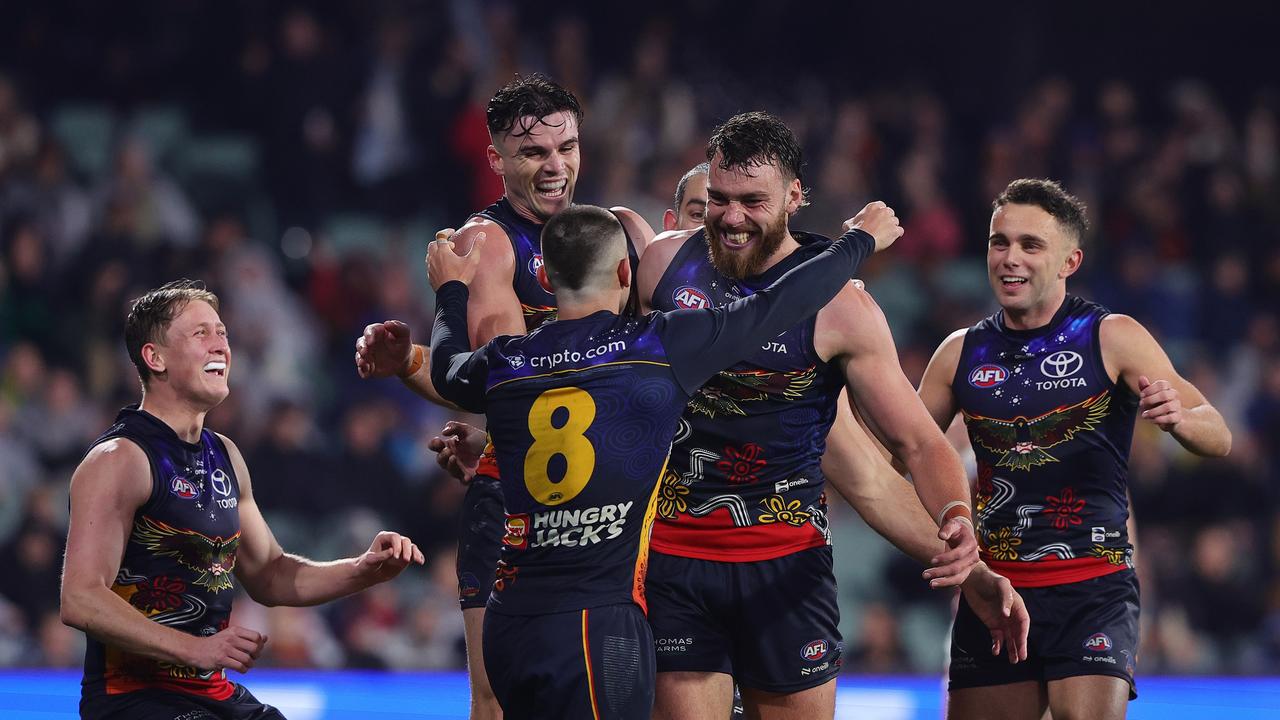 The Crows celebrate Riley’s first goal in his comeback game. (Photo by Sarah Reed/AFL Photos via Getty Images)