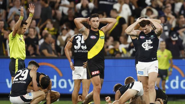 MELBOURNE, AUSTRALIA – MARCH 16: Players from both sides react on the final siren during the round one AFL match between Richmond Tigers and Carlton Blues at Melbourne Cricket Ground, on March 16, 2023, in Melbourne, Australia. (Photo by Daniel Pockett/Getty Images)