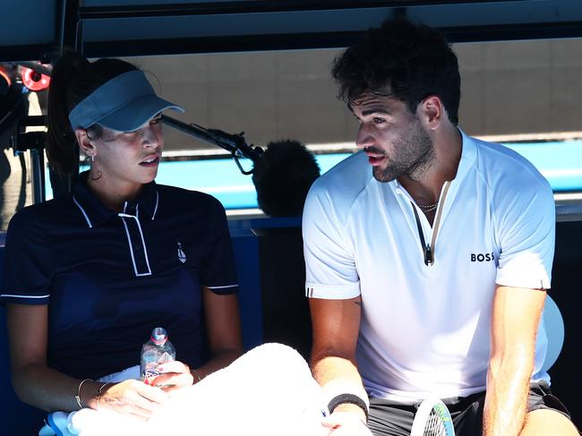 MELBOURNE, AUSTRALIA - JANUARY 16: Ajla Tomljanovic of Australia sits with Matteo Berrettini of Italy during a practice session ahead of the 2022 Australian Open at Melbourne Park on January 16, 2022 in Melbourne, Australia. (Photo by Clive Brunskill/Getty Images)