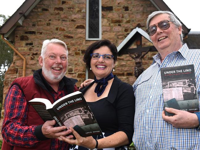 Bruce Morcombe (left) with brother Perry and author Caylie Jeffery at the launch of Under the Lino.  Picture: John Gass/AAP