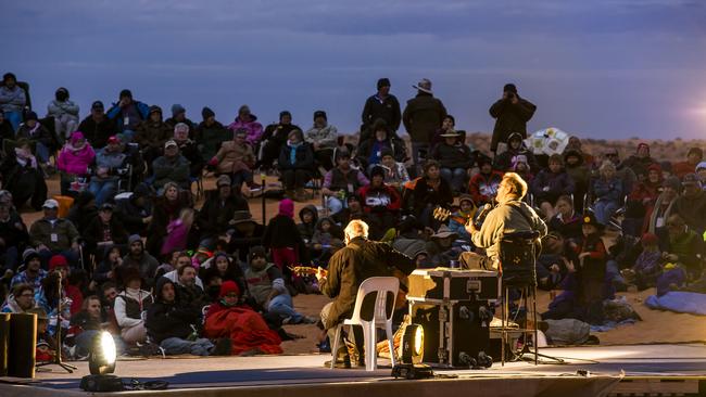 John Williamson, right, performing at the first Big Red Bash in 2013 with guitarist Colin Watson atop the Big Red sand dune in far western Queensland. Picture: Jason Malouin