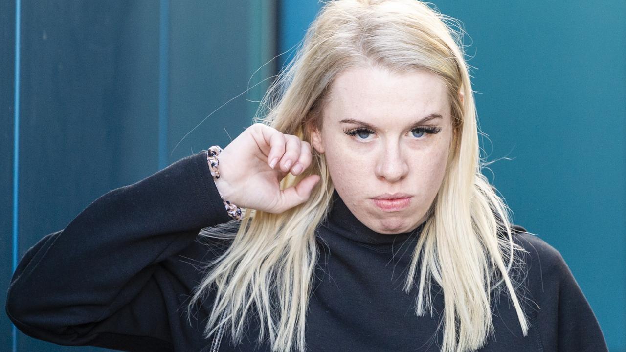 Isobel Rose Higgins, 24, leaves the Toowoomba Watch House after being charged with being an accessory after the fact of murder of Thor Morgan.