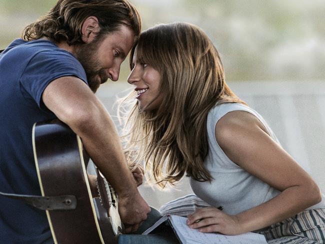 This image released by Warner Bros. Pictures shows Bradley Cooper, left, and Lady Gaga in a scene from "A Star is Born." The producers behind hits "Black Panther," "Crazy Rich Asians," "A Star Is Born" and "Bohemian Rhapsody" are among the 10 nominees for the top prize at the Producers Guild Awards announced Friday, Jan. 4, 2019. (Warner Bros. Pictures via AP, File)