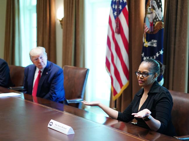 US President Donald Trump and members of the coronavirus Task Force listen to Karen Whitsett during a meeting with patients. Picture: AFP