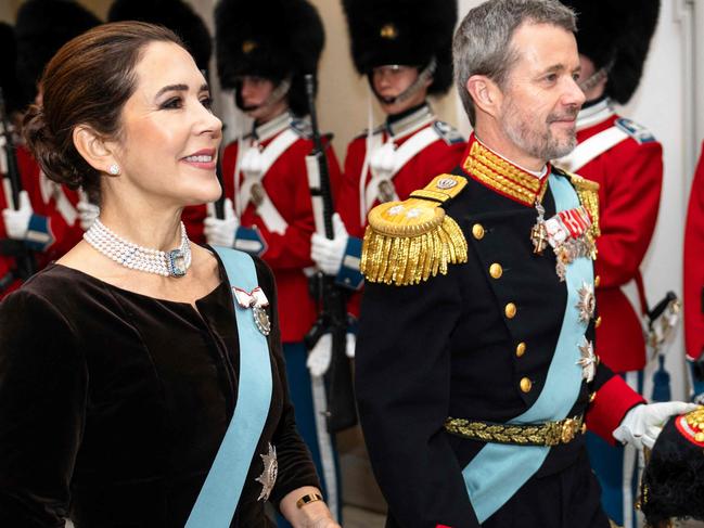 Crown Prince Frederik of Denmark (R) and Crown Princess Mary of Denmark review an honour guard as they arrive to the New Year's cure for officers from the Armed Forces and the National Emergency Management Agency, as well as invited representatives of major national organizations and the royal patronage at Christiansborg Castle in Copenhagen on January 4, 2024. Denmarks' Queen Margrethe announced in her New Years speech that she is abdicating on February 14, 2024. Crown Prince Frederik will take her place and become King Frederik the 10th of Denmark, while Australian born Crown Princess Mary will be Queen of Denmark. (Photo by Mads Claus Rasmussen / Ritzau Scanpix / AFP) / Denmark OUT