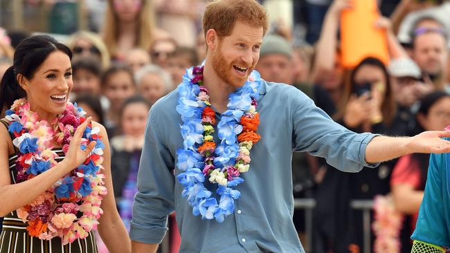 Harry and Meghan being “lovely” during their visit here last year is the least they could do, considering Australian taxpayers picked up their tab. Picture: Saeed Khan/AFP