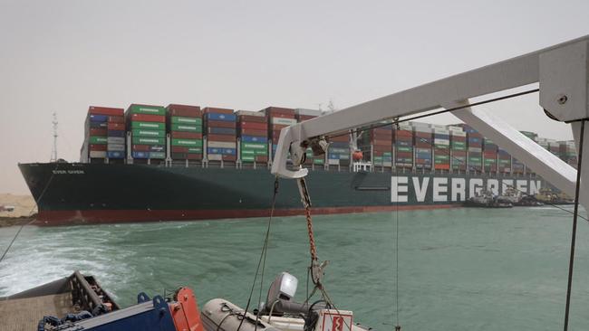 Egypt's Suez Canal Authority said it was "temporarily suspending navigation" until refloating of the ship is completed. Picture: AFP)