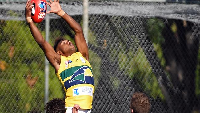 HIGH FLIER: Kysaiah Pickett flies for a screamer in his SANFL league debut against Sturt at Unley. Picture: Tom Huntley.