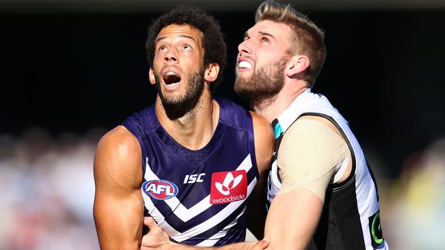 PERTH, AUSTRALIA - JUNE 18: Zac Clarke of the Dockers and Jackson Trengove of the Power contest the ruck during the round 13 AFL match between the Fremantle Dockers and the Port Adelaide Power at Domain Stadium on June 18, 2016 in Perth, Australia. (Photo by Paul Kane/Getty Images)