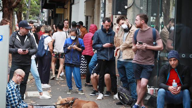 Desperate and jobless: newly unemployed workers line up at Centrelink in Surry Hills, Sydney, after the MyGov website crashed. Picture: John Feder