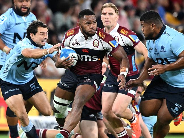 BRISBANE, AUSTRALIA - MARCH 15: Filipo Daugunu of the Reds breaks away from the defence during the round five Super Rugby Pacific match between Queensland Reds and NSW Waratahs at Suncorp Stadium, on March 15, 2025, in Brisbane, Australia. (Photo by Bradley Kanaris/Getty Images)