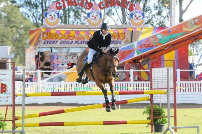 Brett Warren clears a jump on Aalmo in Thursday's C Grade show jumping event at the 2012 Gympie Show. Picture: Craig Warhurst