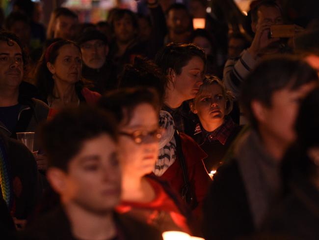 People gather to mourn, honour, and remember the victims of the Orlando nightclub mass shooting during a vigil in Newtown, in Sydney.