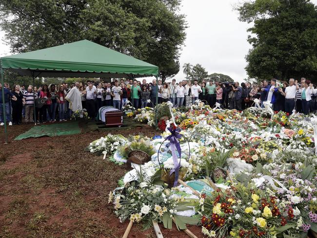 Mourners attend the burial of Chapecoense president Sandro Pallaoro, who died in the crash, in Chapeco, Brazil, on Sunday. Picture: AP/Andre Penner