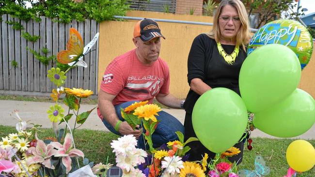 Shandee Blackburn&#39;s mother Vicki Blackburn and her husband Paul Beardmore place balloons and flowers at the spot where Shandee was murdered to mark her 24th birthday. Picture: Lee Constable